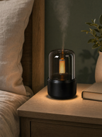 Mist diffuser with warm night light on a bedside table